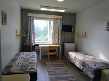 Фото номера Двухместный номер с 2 отдельными кроватями Хостелы Hostel Vanha Koulu г. Monola 6
